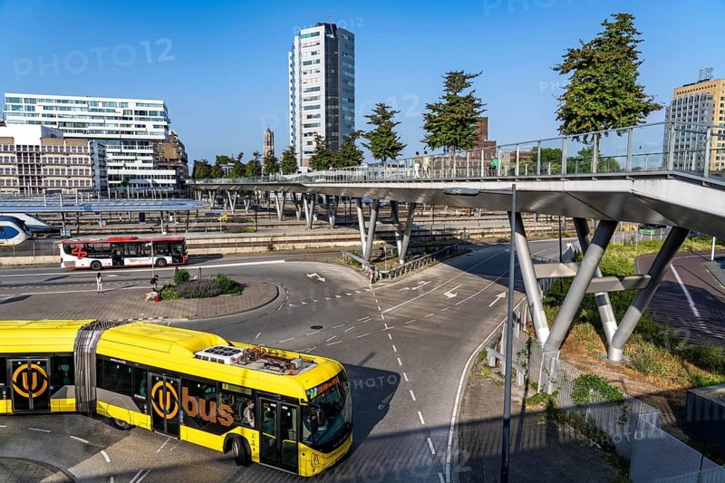 The Moreelsebrug, pedestrian and cycle bridge over the tracks of Utrecht Centraal, Central Station, Greened with trees, Netherlands