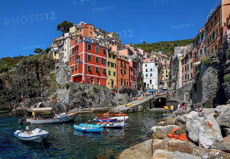 Fishing boats in the harbour of Riomaggiore, village view, Cinque Terre, province of La Spezia, Liguria, Italy