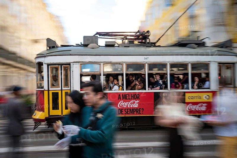 LISBON, PORTUGAL - MAY 19, 2025: Famous tram number 28 at the street of the city. Photo taken using the panning technique
