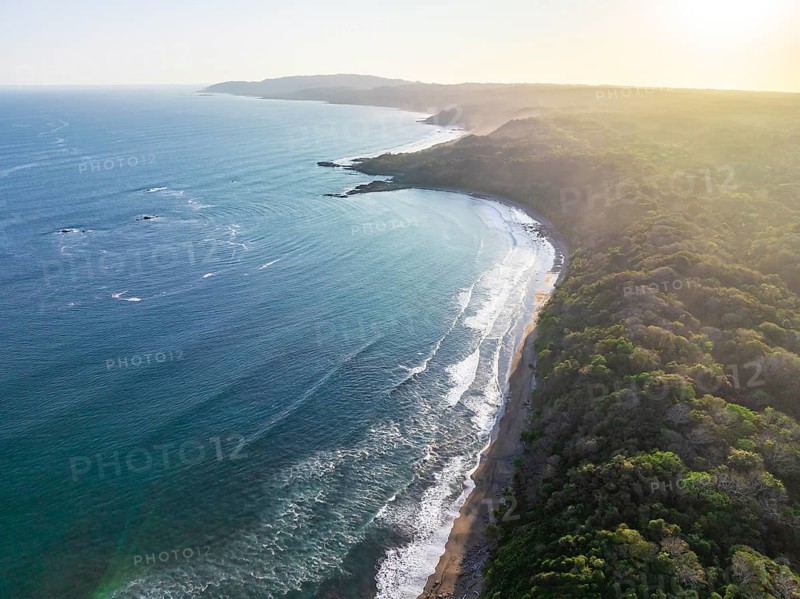 Aerial view, rainforest, sandy beach and coast with waves, Playa Cocalito, Puntarenas, Costa Rica