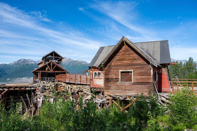 Red Kennicott buildings in front of mountainous landscape, Kennicott Concentration Mill to extract copper from quarried rock, Historic Kennecott Copper Mine, National Historic Landmark, Wrangell St. Elias National Park, Alaska, USA