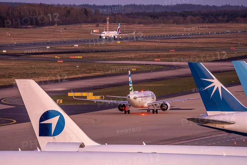 Eurowings Airbus at Cologne-Bonn airport, taking off, aircraft taking off on the taxiway, cargo aircraft at the air freight center, North Rhine-Westphalia, Germany