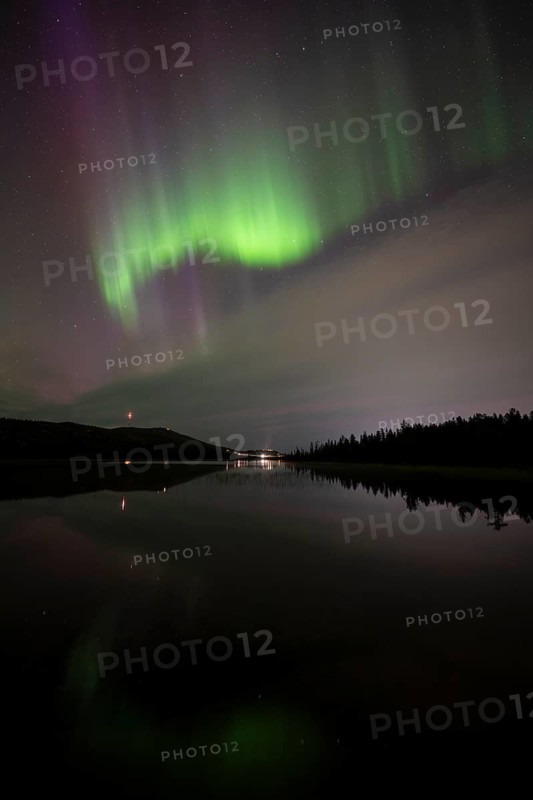Northern Lights (Aurora borealis) over a forest lake, Gällivare, Norrbotten, Lapland, Sweden, September 2023