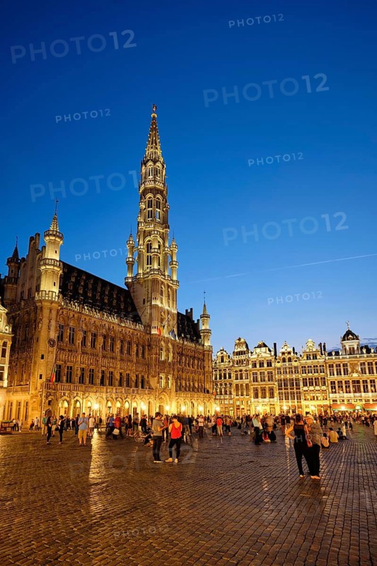 BRUSSELS, BELGIUM, MAY 31, 2018: Grote Markt (Grand Place) square crowded with tourists illuminated at night. Bruxelles, Belgium