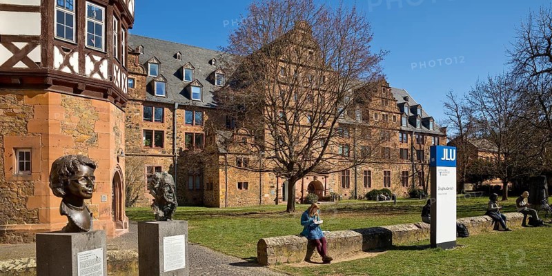 Giessen heads in front of the New Palace and the armoury of Justus Liebig University, Giessen, Hesse, Germany
