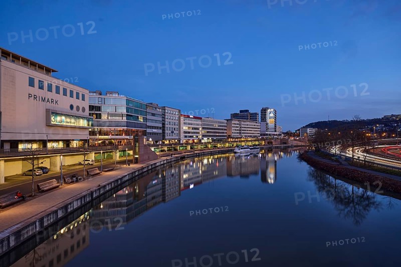 River Saar, modern architecture, trees, fashion shop, Primark, reflections on the water surface, light traces, evening blue hour, blue evening sky, cirrostratus clouds, Willi Graf Ufer, Berliner Promenade, motorway 620, Saarbrücken, state capital, regional association Saarbrücken, Saarland, Germany