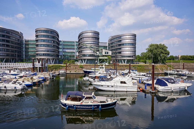Five Boats office building, marina in the inner harbour and motorboat of a driving school in Duisburg, Ruhr area, independent city, North Rhine-Westphalia, Germany