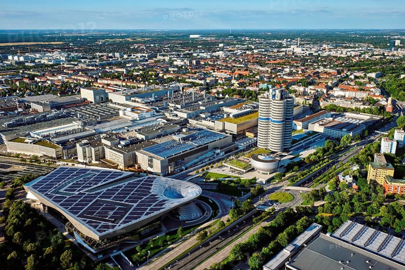 MUNICH, GERMANY, JULY 08, 2018: Aerial view of BMW Museum and BWM Welt and factory and Munich from Olympic Tower. BMW is a famous German luxury car automaker