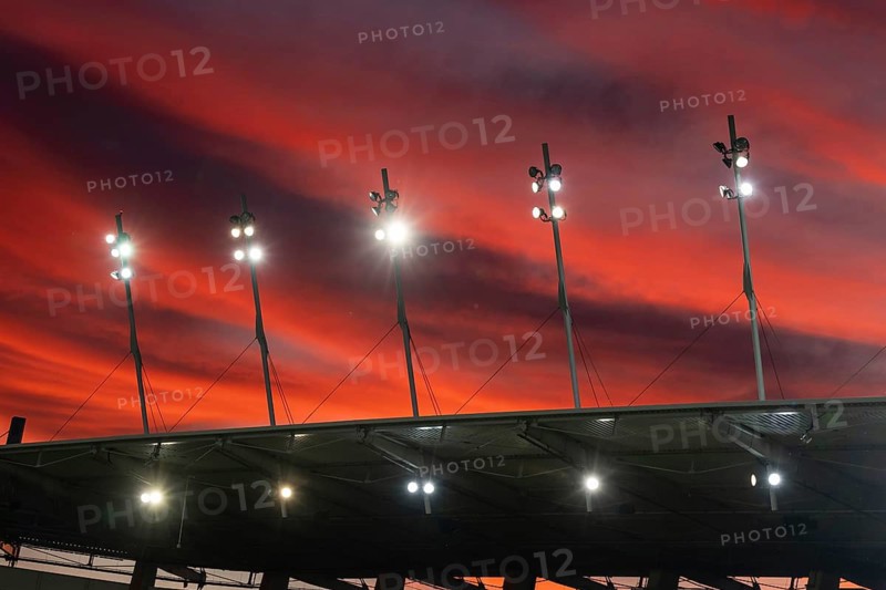 Stadium roof spotlights with a beautiful colorful sky at dusk in Lubin, Poland