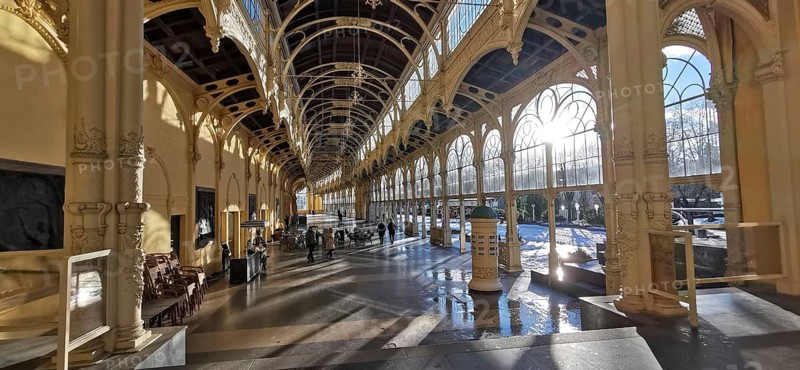 Large, sun-drenched interior of a historic hall with arched windows and columns, wellness, Marienbad, Czech Republic