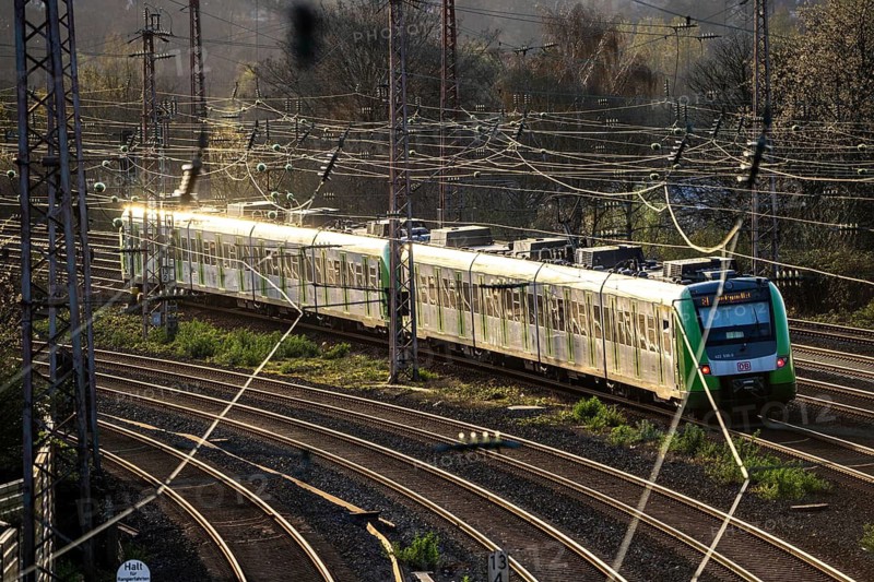 S-Bahn train on the tracks, railway layout, railway line west of the main station of Essen, North Rhine-Westphalia, Germany