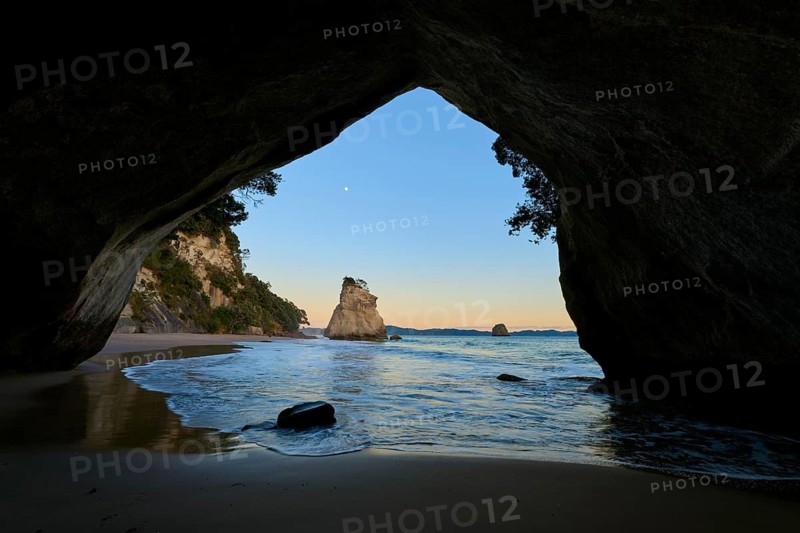 View from a cave onto the calm sea with rock formations, Cathedral Cove, Coromandel, Canterbury, North Island, New Zealand