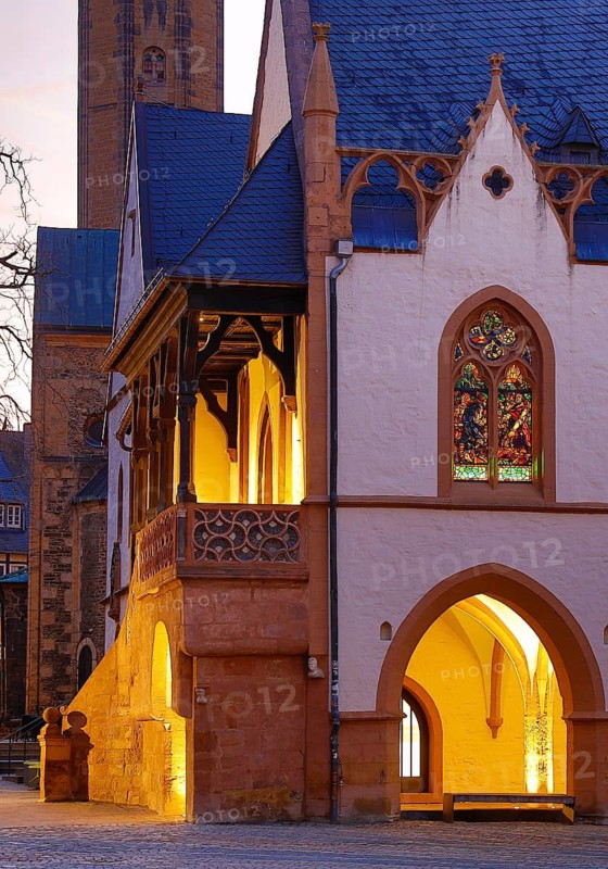 View of the late Gothic town hall of Goslar with the market church from the market square in the evening, UNESCO World Heritage Site, Lower Saxony, Germany