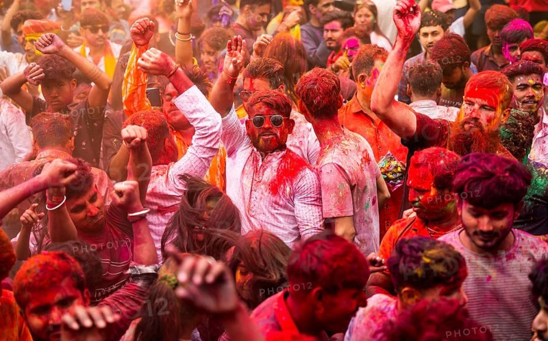 Revellers smear with Gulal or coloured powder and dance to play Holi, the Hindu spring festival of colours, on March 14, 2025 in Guwahati, India