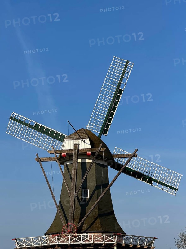 Meyer Mühle or Meyers Mühle with millstone fountain on the main canal, Papenburg, Emsland, Lower Saxony, Germany