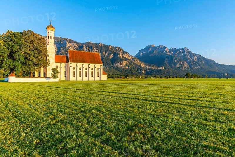 Baroque church St. Coloman, behind it Neuschwanstein Castle and the mountain Saeuling, 2047m, Schwangau, Ostallgaeu, Allgaeu, Swabia, Bavaria, Germany