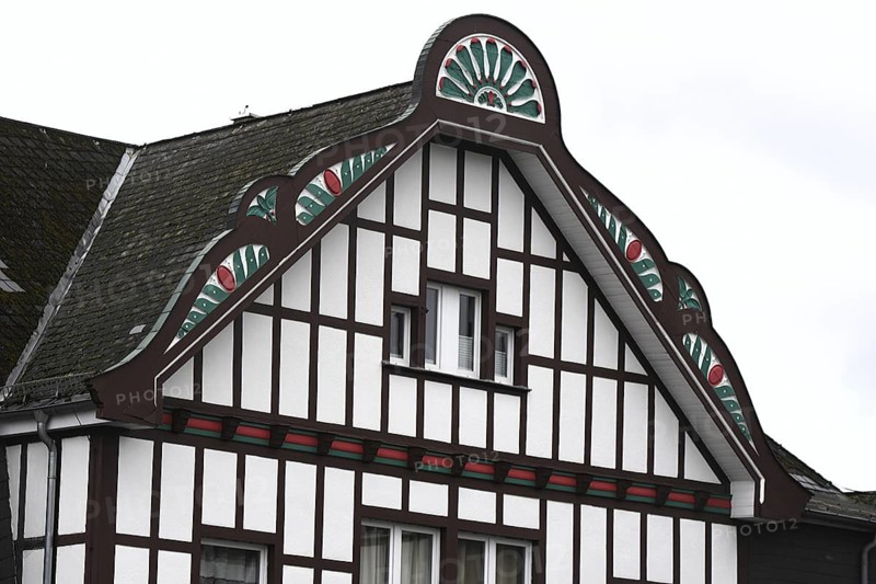 Half-timbered façade with colourful ornaments. The building is part of the Heimhof Theatre complex in Burbach-Würgendorf / Wasserscheide