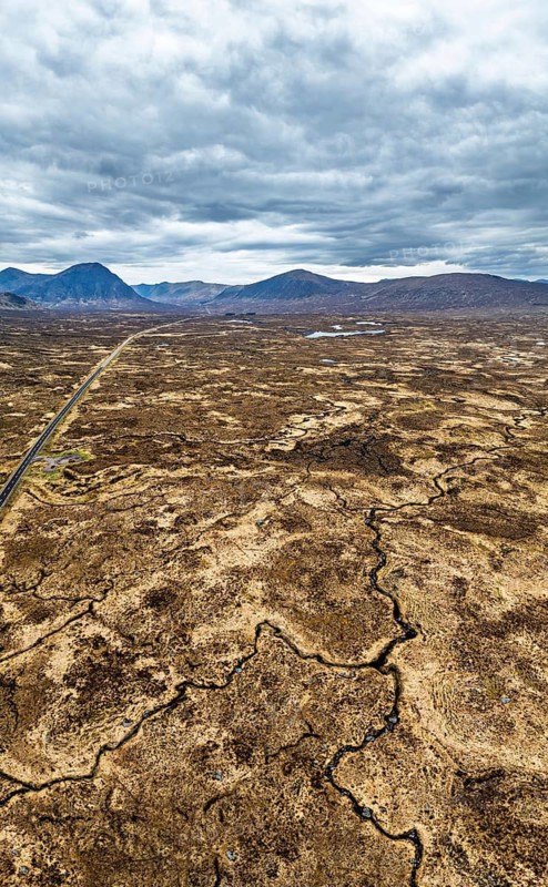 Panorama of Rannoch Moor from a drone over Loch Ba and Loch of the Armpit, A82 Highland Way, Argyll and Bute, West Highlands, Scotland, United Kingdom