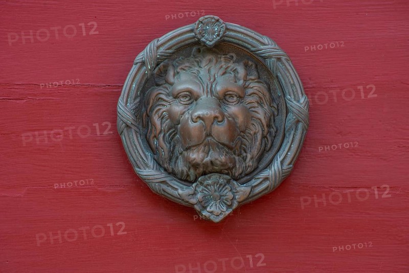 Lion's head as a door knocker in Ystad, Skåne county, Sweden, Scandinavia