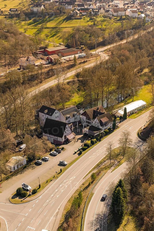 Building on a rural road with parking lot and surrounding trees, Pfrondorf, Nagold, Calw district, Germany