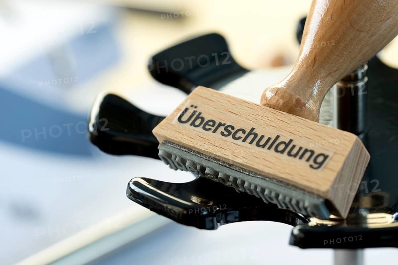 A stamp with the inscription Überschuldung, Federal Republic of Germany