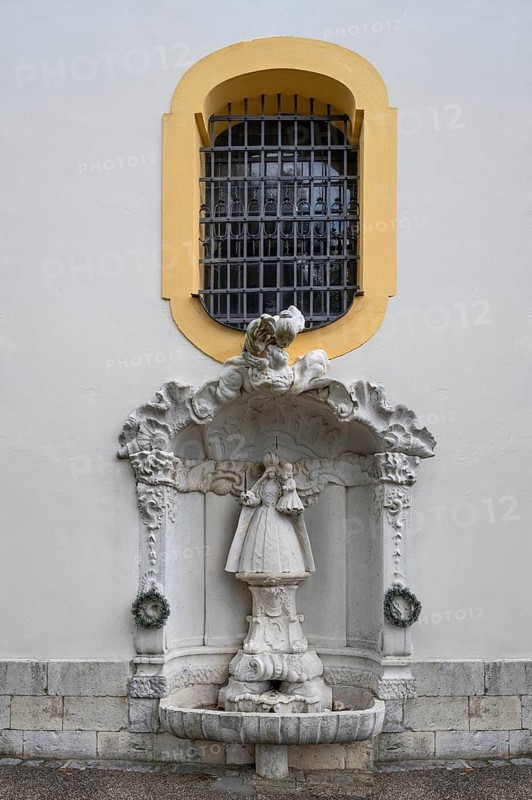 Fountain with the sculpture of the Virgin Mary at the pilgrimage basilica Maria Brünnlein, Wemding, Swabia Bavaria, Germany
