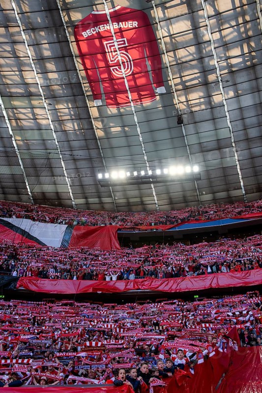 Larger-than-life jersey of Franz Beckenbauer with shirt number 5 hangs in the roof of the south curve, 125th anniversary of FC Bayern Munich FCB, fan block, fans, fan curve, scarves, atmosphere, Allianz Arena, Munich, Bavaria, Germany