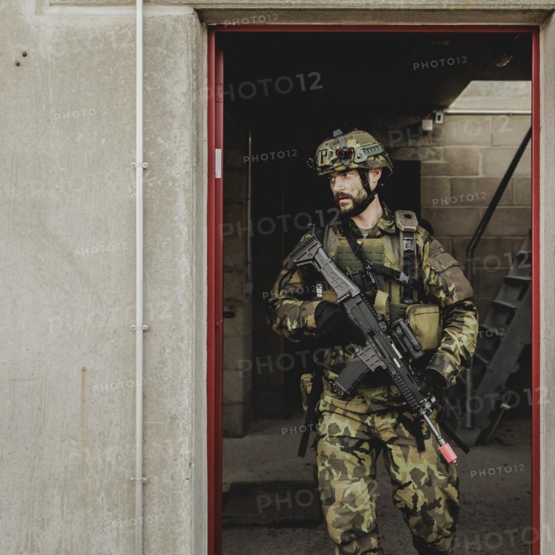 A soldier moves during a simulated house-to-house battle, taken as part of a Bundeswehr exercise with armed forces from Norway and the Czech Republic during the 'Wettiner Schwert' exercise as part of Quadriga 2024 in the training town of Schnöggersburg, 8 April 2024