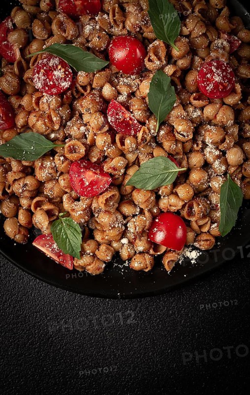 Tuscan pasta with smoked paprika and basil, parmesan cheese, Italian traditional cuisine