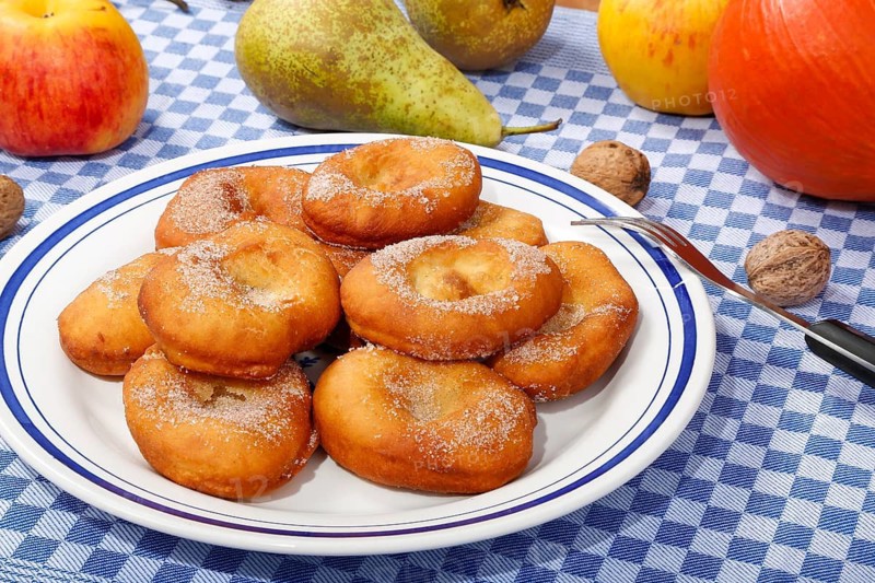 Swabian cuisine, harvest cakes, dessert, dessert, fat baked goods, doughnuts, fried food, lard noodles, arranged on a plate, grandmother's kitchen, regional, home cooking, typical Swabian, classic recipe, traditional cuisine, food photography, autumn atmosphere, apples, pears, nuts, still life, studio, Germany