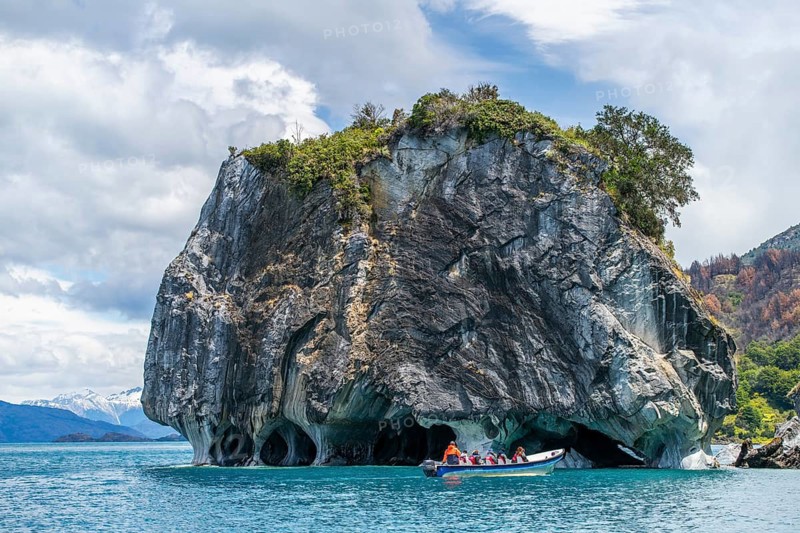 Motorboat with tourists at the rock formation of the marble cathedral, Cuevas de Marmol, marble caves in Lago General Carrera, Puerto Rio Tranquilo, Aysen region, Patagonia, Chile