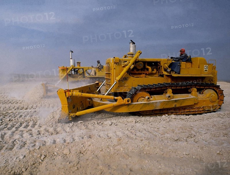 Oil industry in the Ras Tanura area, Saudi Arabia, D6H Tracked bulldozer in desert construction 1979