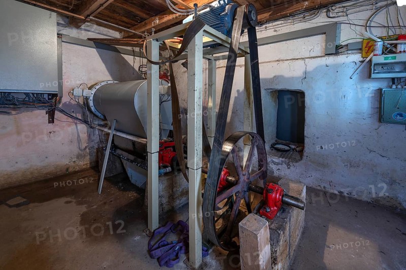 A horizontal Francis turbine, power generation with transmission drive in a former corn mill, Bavaria, Germany
