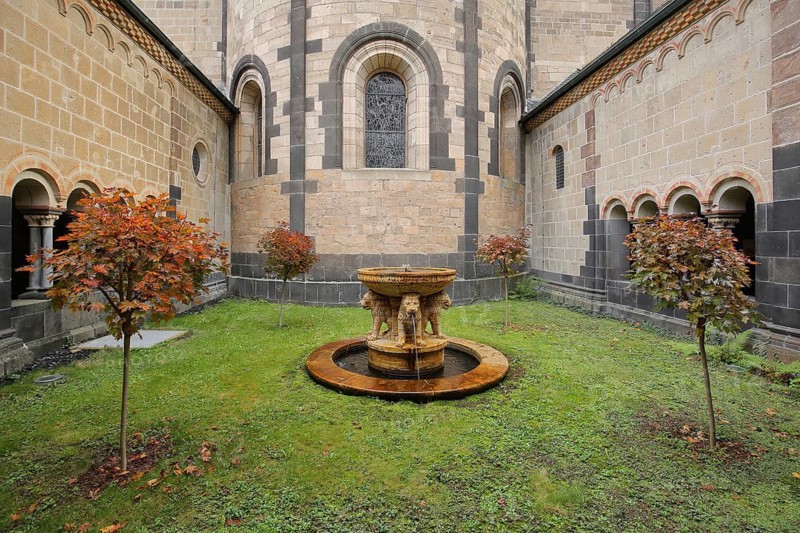 Courtyard with lion fountain in autumn colors, Romanesque, Maria Laach, Benedictine Abbey, Eifel, Rhineland-Palatinate, Germany