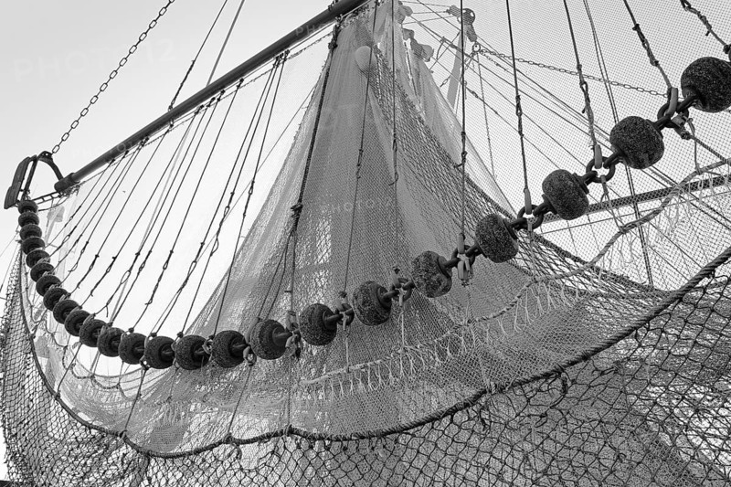 Trawls hanging from a shrimp cutter, black and white, North Sea, Greetsiel, Lower Saxony, Germany