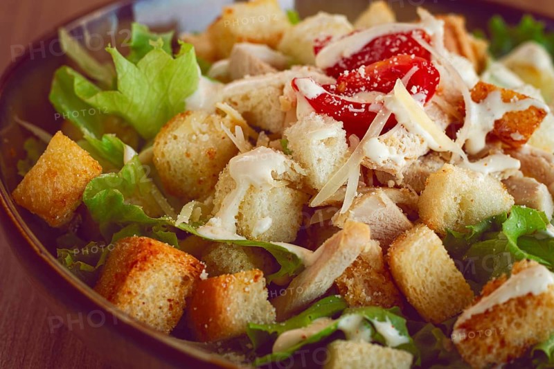 Classic Caesar salad, close-up, natural light, selective focus, horizontal