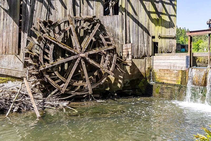 Historic hammer mill on the Rot near Oberrot. The building and the waterwheel are completely ruined. Oberrot, Baden-Württemberg, Germany