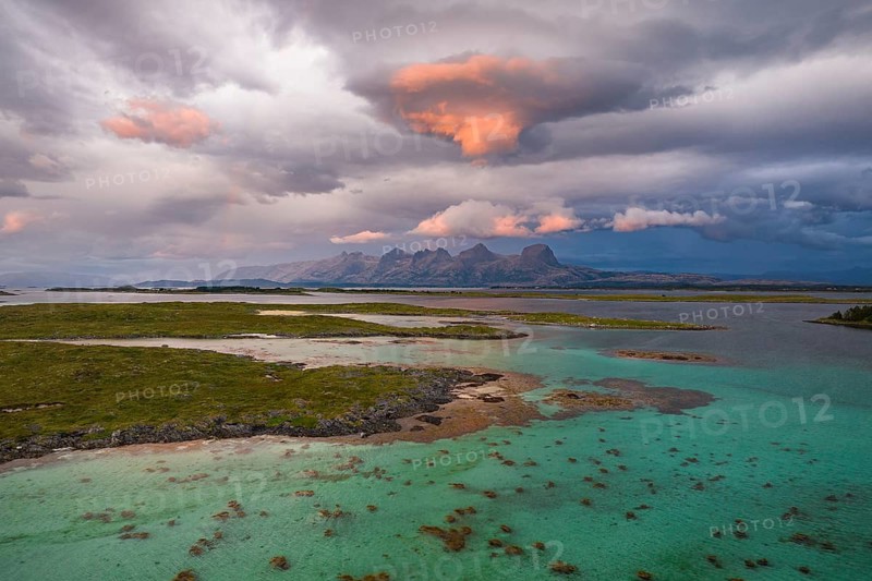 View of mountain range Seven Sisters from Herøy island, light mood, Helgeland coast, Nordland, Norway