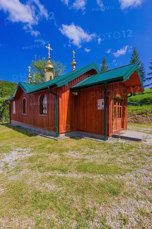 Building nexts to the wooden Greek-Catholic church of St. Nicholas in Bodružal, Slovakia