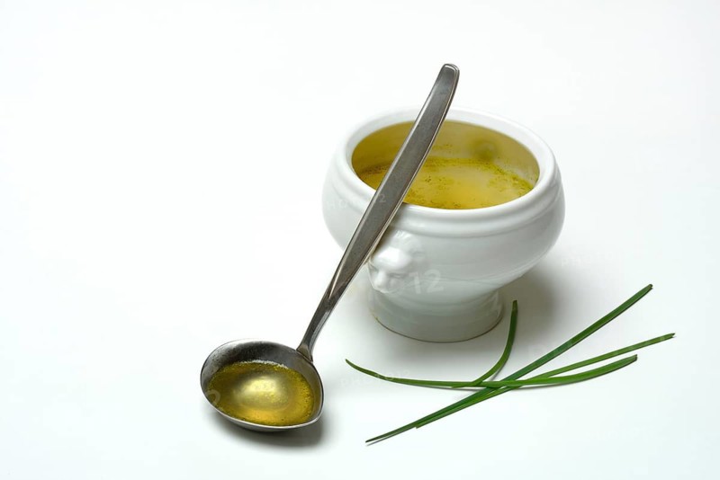 Bouillon, vegetable broth with ladle and bowl