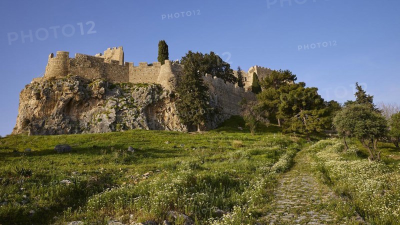 Morning light, St John's fortress, ascent to the Acropolis, Lindos, green meadows, Rhodes, Dodecanese, Greek Islands, Greece