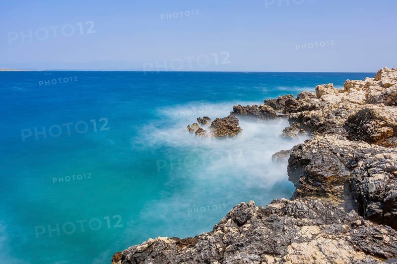 Romantic view over the sea in Koromacna Bay on a sunny day with rough seas on the island of Cres, long exposure, Croatia