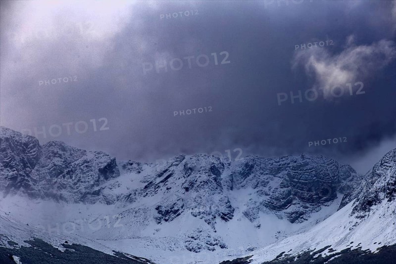 Shady mountains with snow under dark, threatening clouds, Ushuaia, Argentina