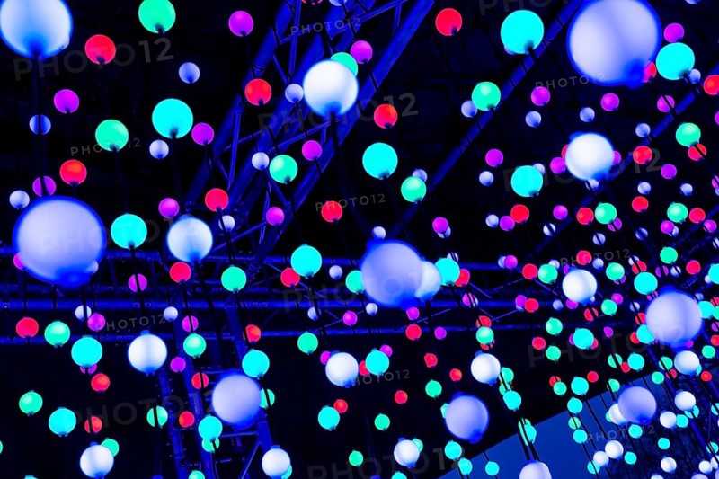 Light, glowing balls, LED lamps, hang in series, side by side, on top of each other, change their light color, light installation at park lights in the Grugapark in Essen