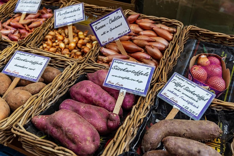 Sweet potatoes and potatoes of different origins. Market at Carlsplatz. Düsseldorf, North Rhine-Westphalia, Germany