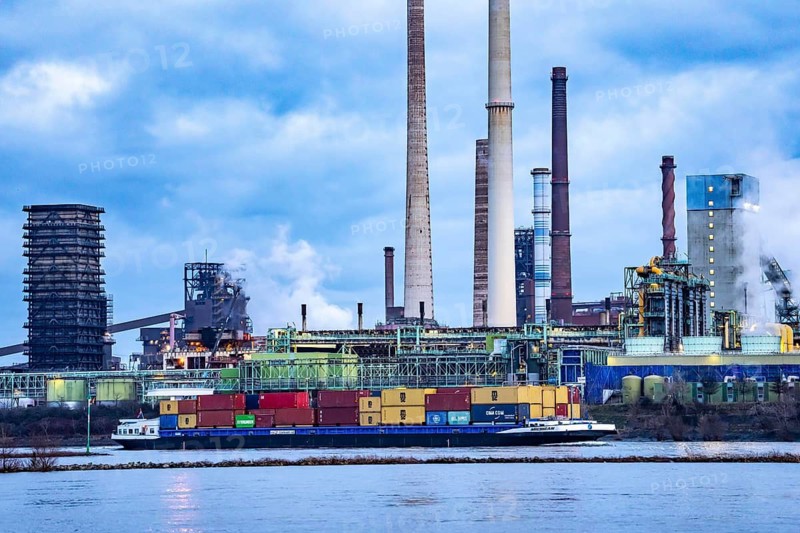 Shipping traffic on the Rhine near Duisburg-Bruckhausen, industrial setting of the ThyssenKrupp steel plant, Schwelgern coking plant, North Rhine-Westphalia, Germany