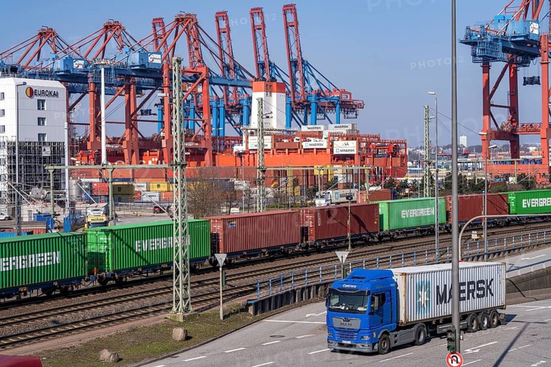 Port of Hamburg, Waltershofer Hafen, container ships, goods train with containers and container lorries bring and collect freight containers to and from HHLA Container Terminal Burchardkai, Hamburg, Germany