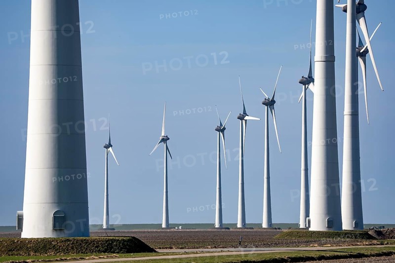 Wind farm in the north of the Netherlands, near Eemshaven, energy center, in addition to wind energy, there are coal and gas power plants and various energy infrastructure facilities here, Netherlands