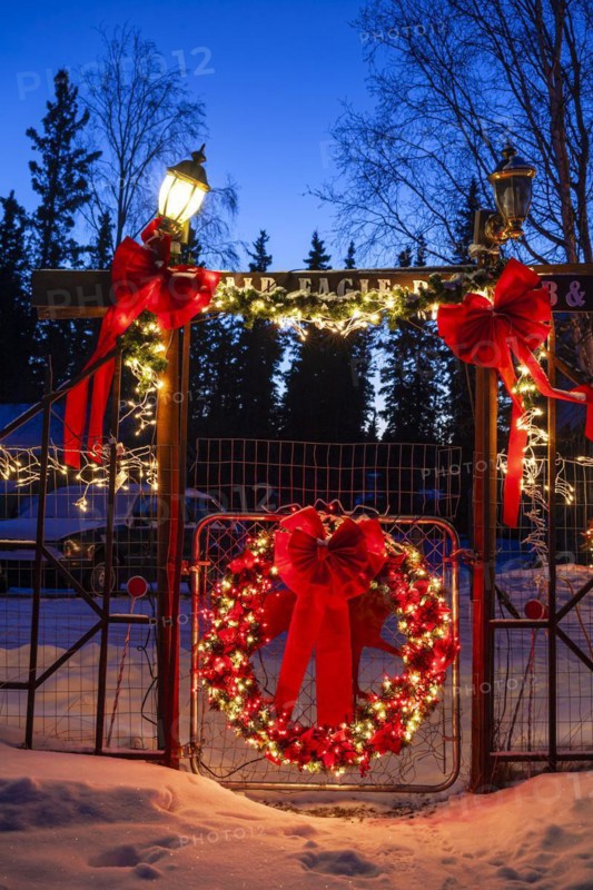 Christmas decorated entrance of a Bed and Breakfast at dusk, Delta Junction, Alaska, USA