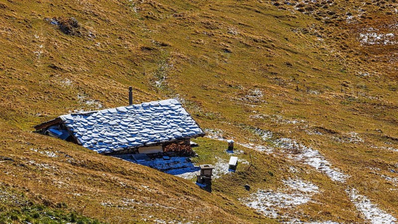 Alpine hut with snow-covered roof, near Grimentz, Val d'Anniviers, Valais Alps, Canton Valais, Switzerland